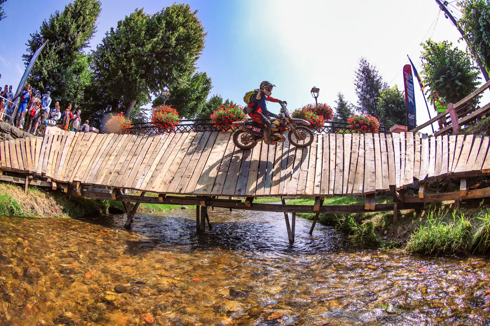 Crossing a wooden bridge during an enduro race