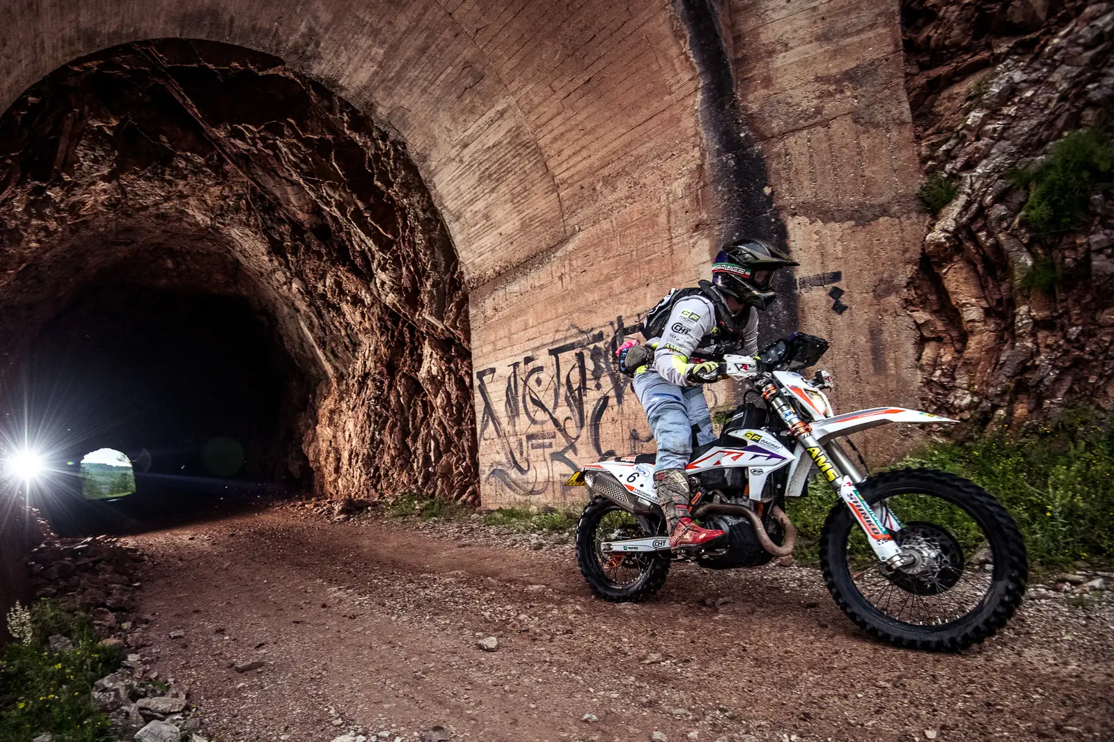 Riding out of a tunnel on an enduro stage
