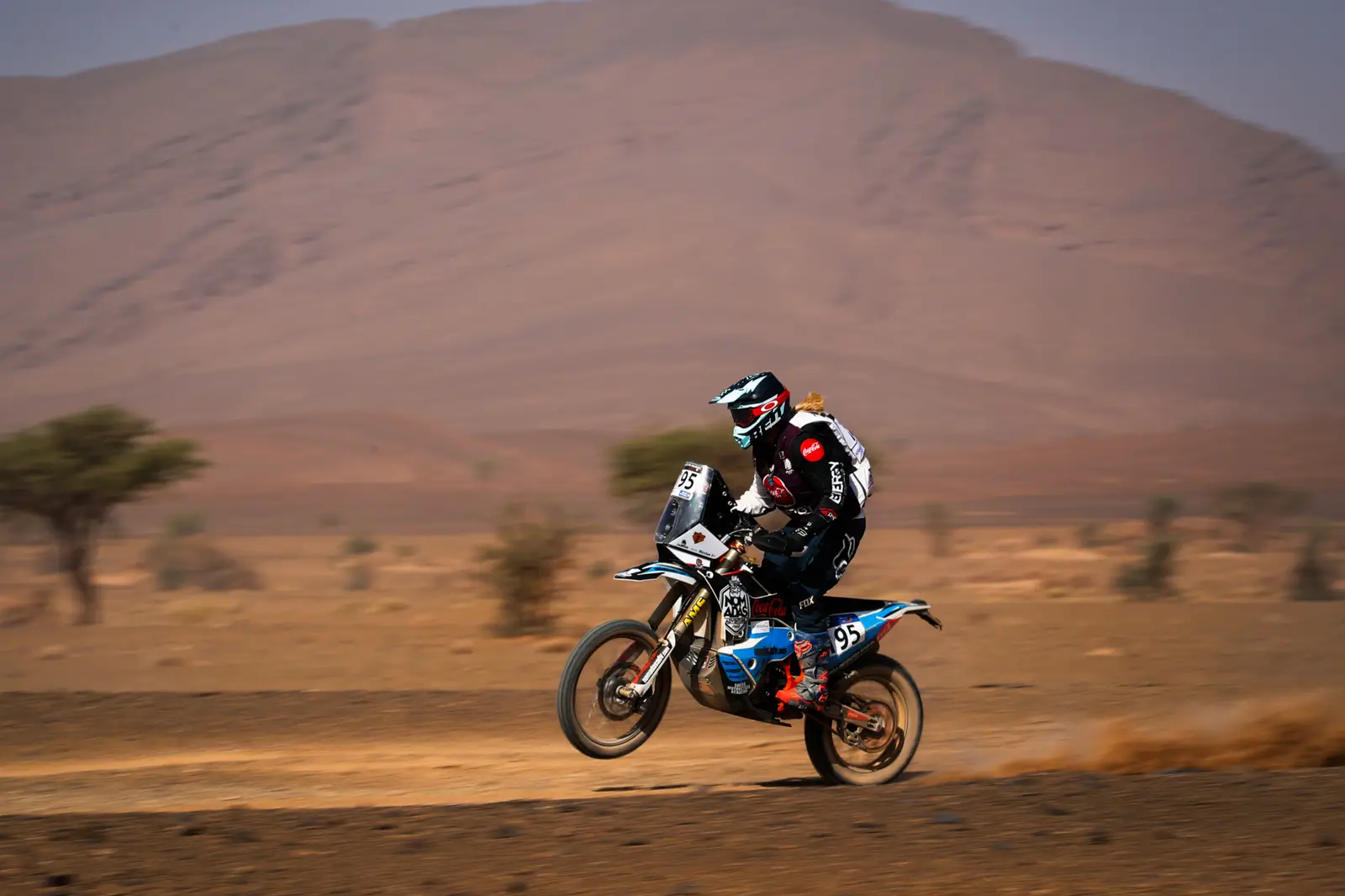 Riding at speed through the Moroccan desert